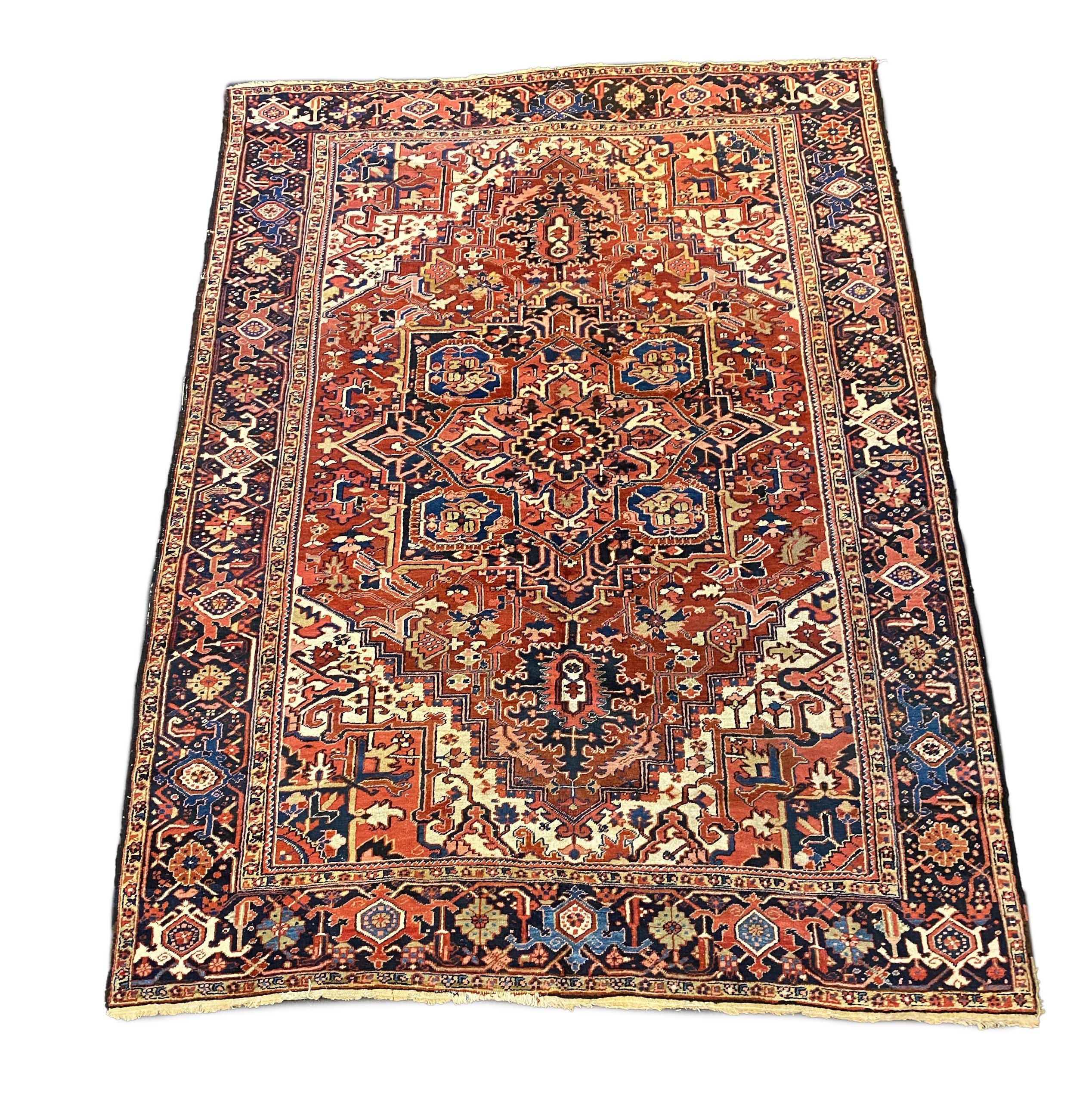 An Heriz red ground carpet, 364 x 265cm